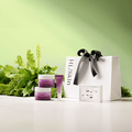 HL Skin Spring Bundle - Reset skincare trio with gift bag and greenery backdrop for hydration and regeneration.